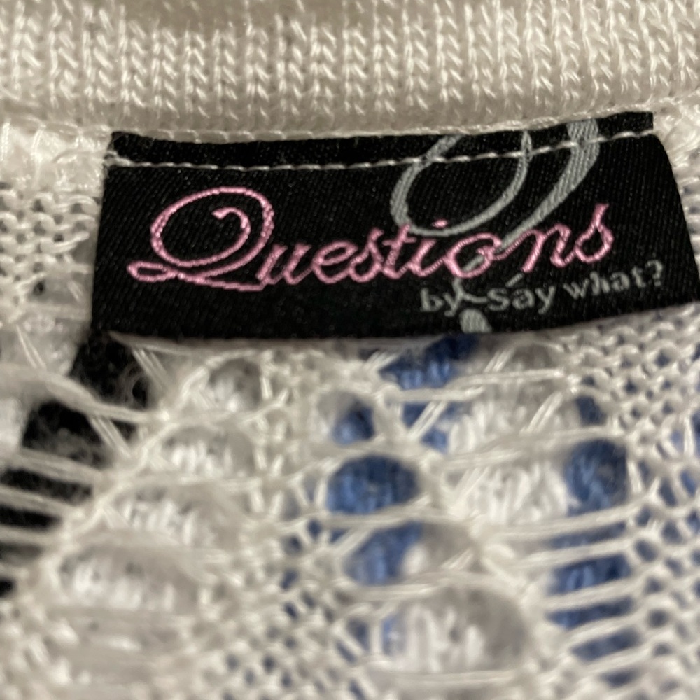Lightweight knitted sweater like a swim cover with buttons